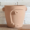 Pottery With Carved Faces