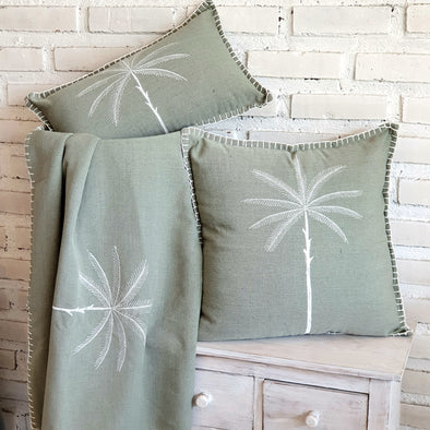 Green Cushion with Embroided Palm Tree Design