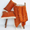 Orange Arrow Stitch Pattern Cushion With Fringe
